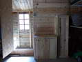 The shed side of the chicken coop with nesting boxes on left and feed hopper on the right - Castel de Cantobre G&icirc;tes, Aveyron, France